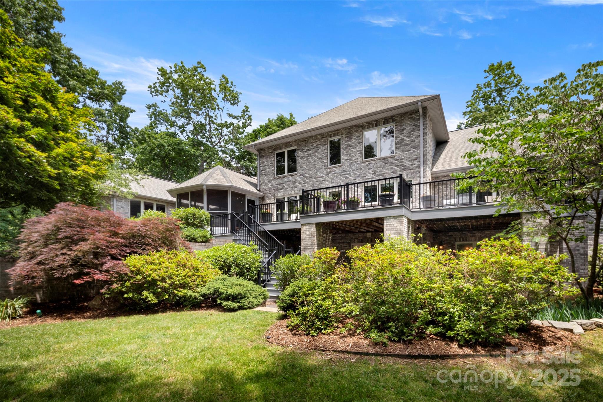 421 North Boundary Road Mill Spring, NC 28756 - Photo 3 of 43 a front view of a house with a garden