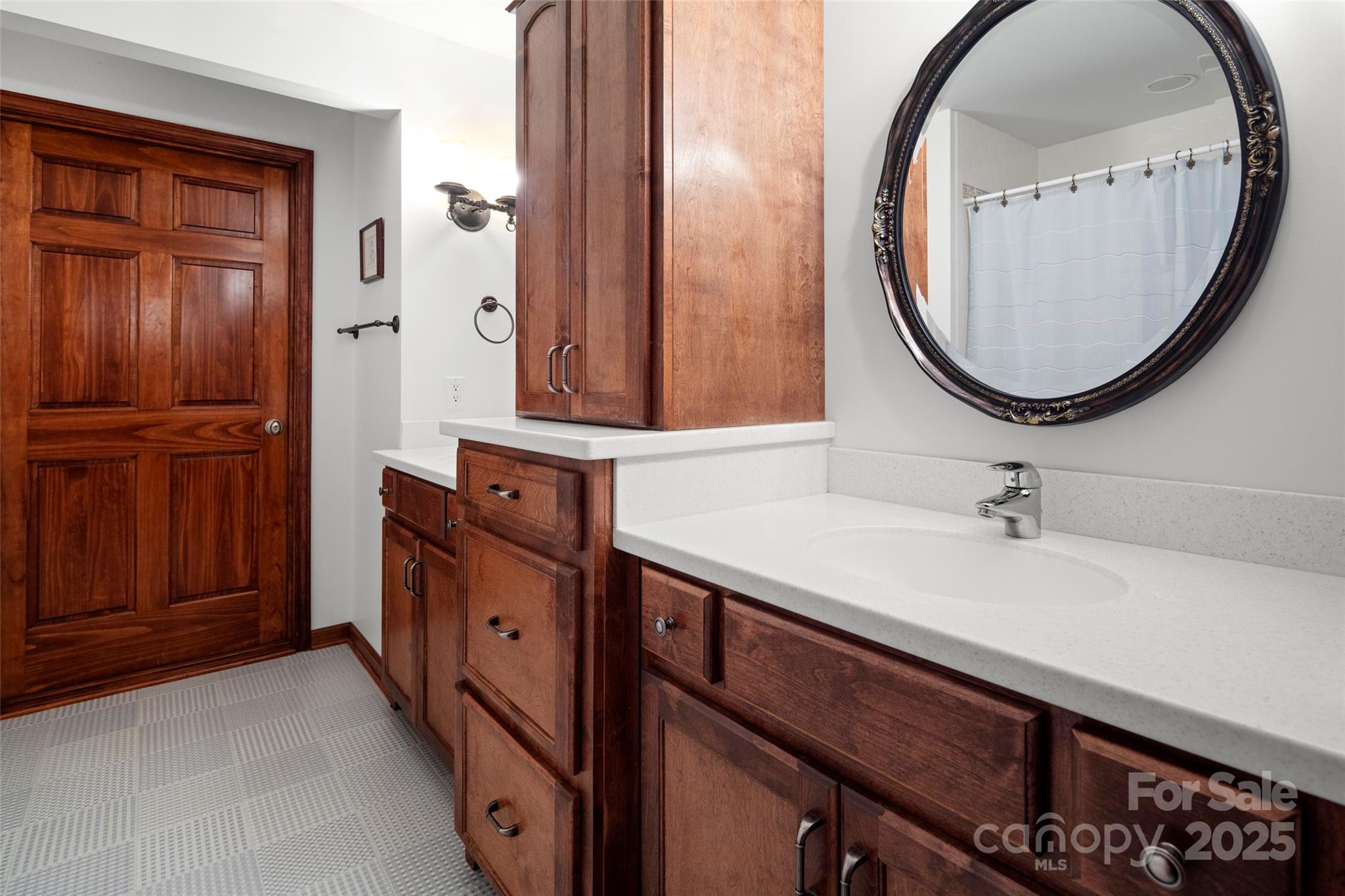 421 North Boundary Road Mill Spring, NC 28756 - Photo 31 of 43 a bathroom with a sink and a mirror