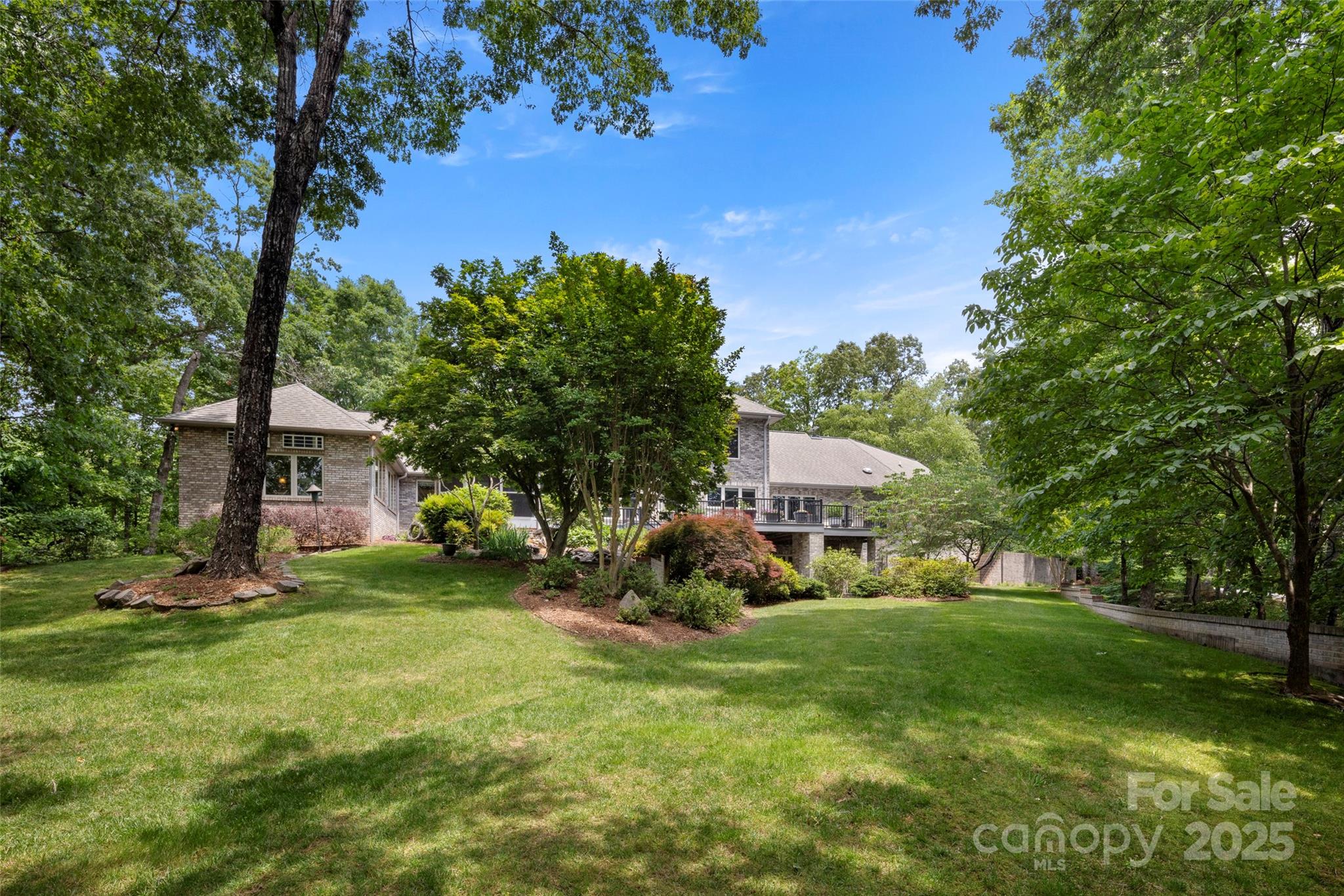 421 North Boundary Road Mill Spring, NC 28756 - Photo 33 of 43 a view of a house with a big yard and large trees