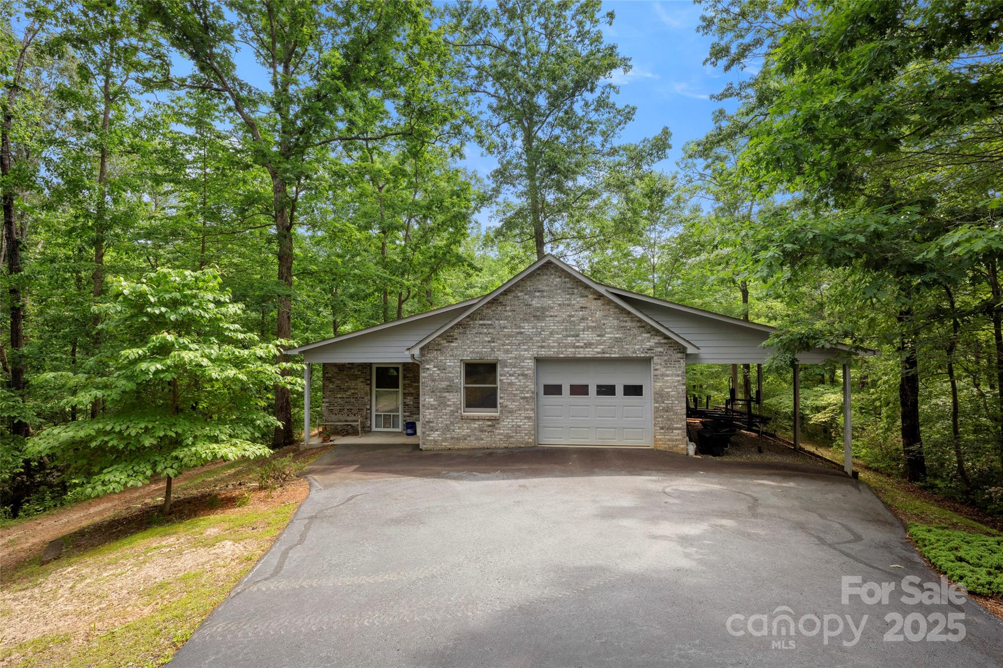 421 North Boundary Road Mill Spring, NC 28756 - Photo 35 of 43 a view of a house with a yard and large trees