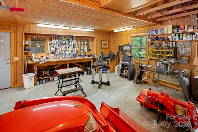 a room with lots of furniture and white walls