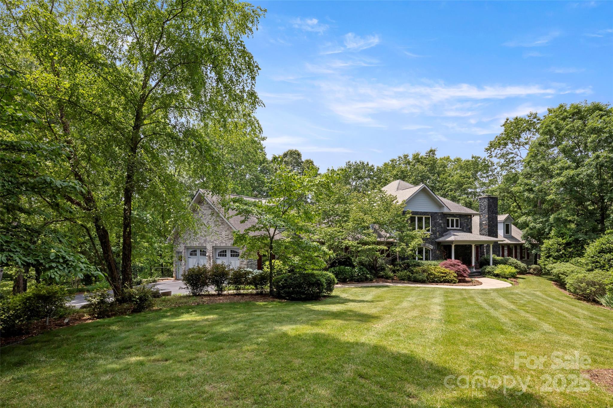 421 North Boundary Road Mill Spring, NC 28756 - Photo 38 of 43 a front view of a house with a yard table and chairs