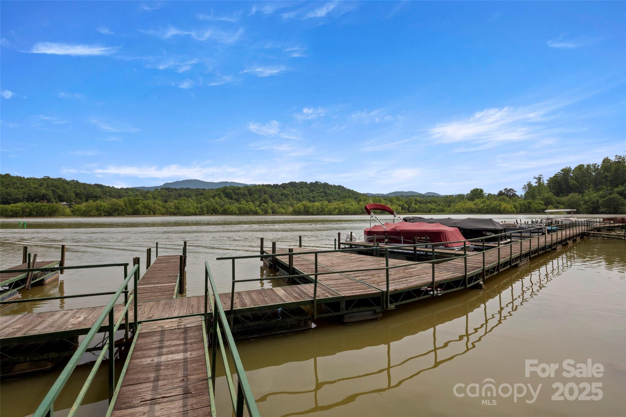 421 North Boundary Road Mill Spring, NC 28756 - Photo 40 of 43 a view of a lake with sitting area