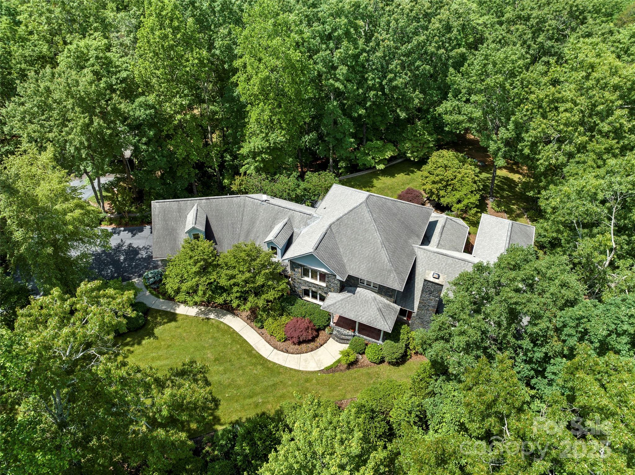 421 North Boundary Road Mill Spring, NC 28756 - Photo 6 of 43 an aerial view of a house with swimming pool and garden