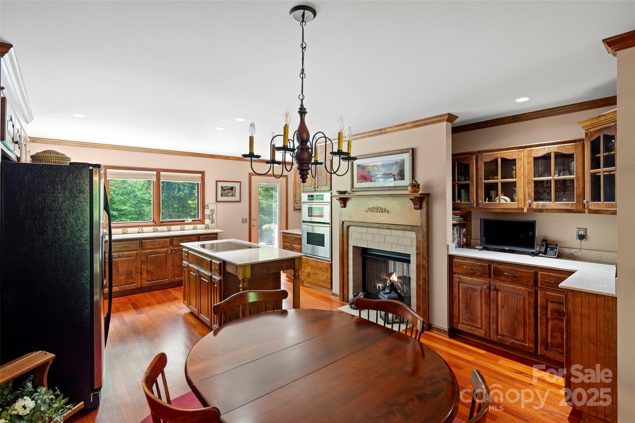 421 North Boundary Road Mill Spring, NC 28756 - Photo 10 of 43 a living room with furniture a fireplace and a chandelier