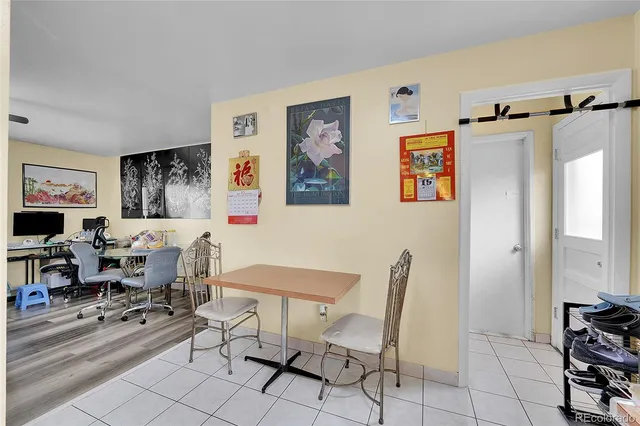 a bedroom with bed and a flat tv screen