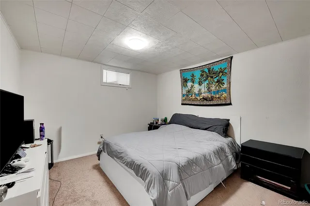 a bathroom with a sink mirror and toilet