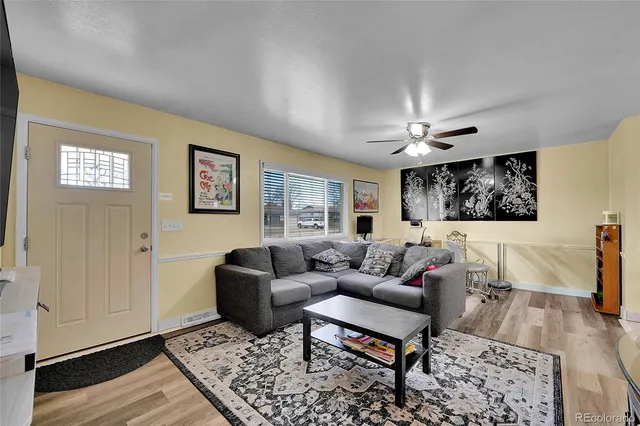 a living room with furniture and a rug