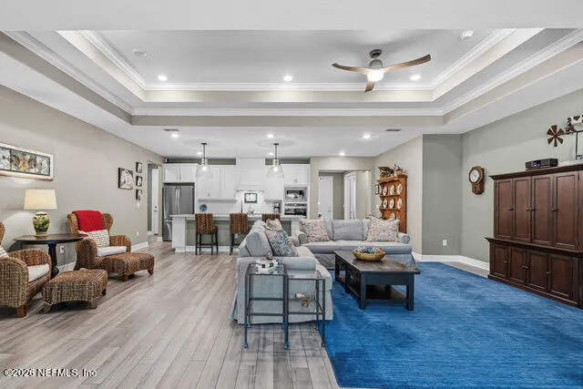 a bedroom with bed and wooden floor