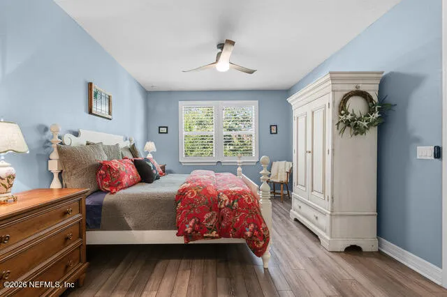 a bathroom with a granite countertop double vanity sinks and a mirror