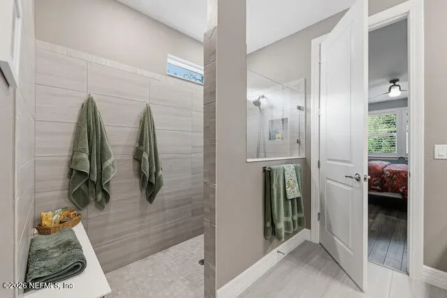 a livingroom with workspace and a flat screen tv