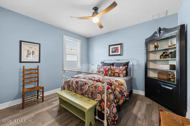 a bathroom with a toilet a sink and a mirror
