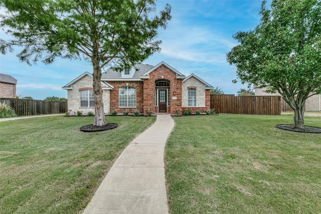 a front view of a house with yard