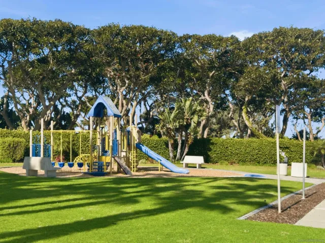 a view of a park with swings