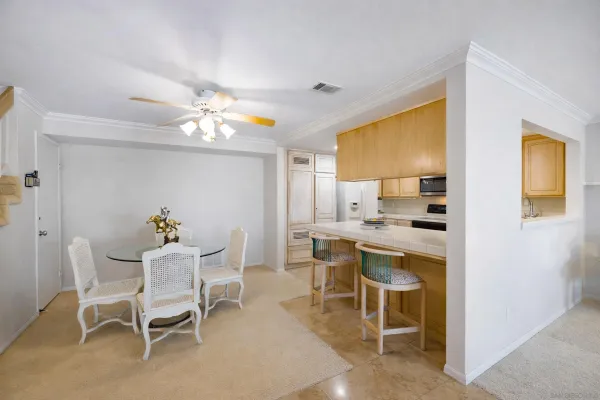 a dining room with furniture and window
