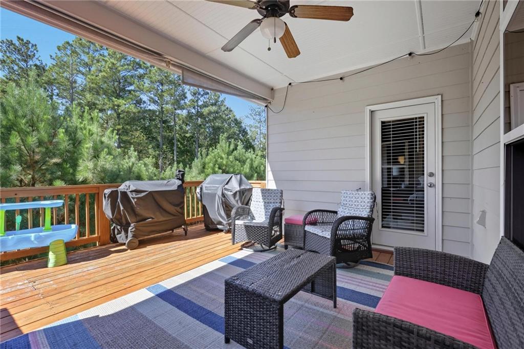 47 Violet Lane Dallas, GA 30132 - Photo 23 of 27 a view of a deck with wooden floor and outdoor seating