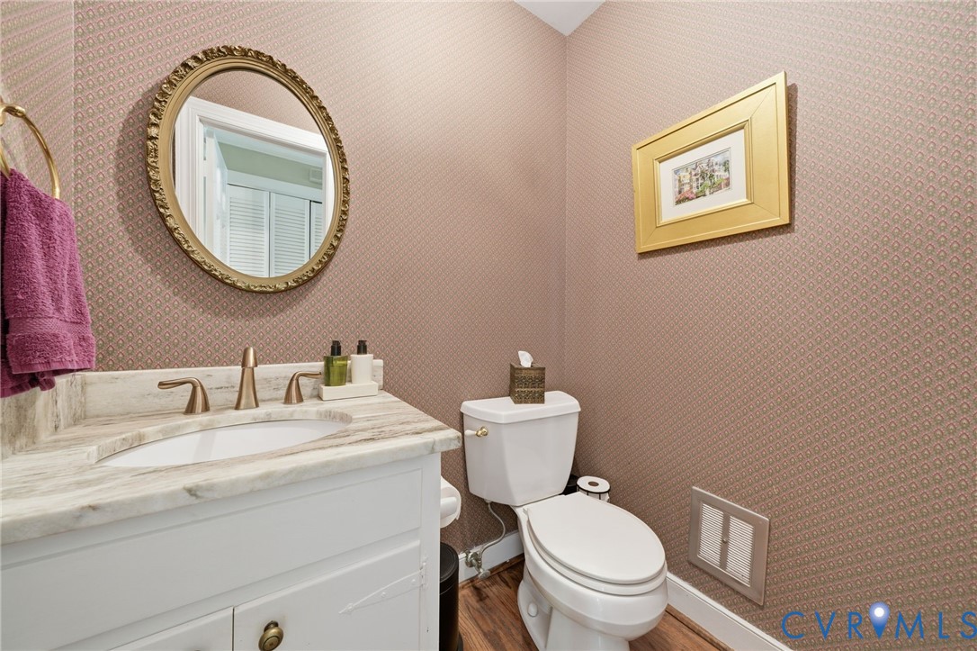 2101 Castlebridge Road Midlothian, VA 23113 - Photo 31 of 37 a bathroom with a toilet a sink and a mirror
