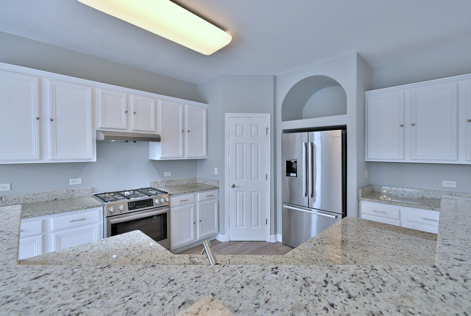 233 Pawtucket Avenue Elgin, IL 60124 - Photo 14 of 49 a kitchen with stainless steel appliances granite countertop a refrigerator sink and cabinets