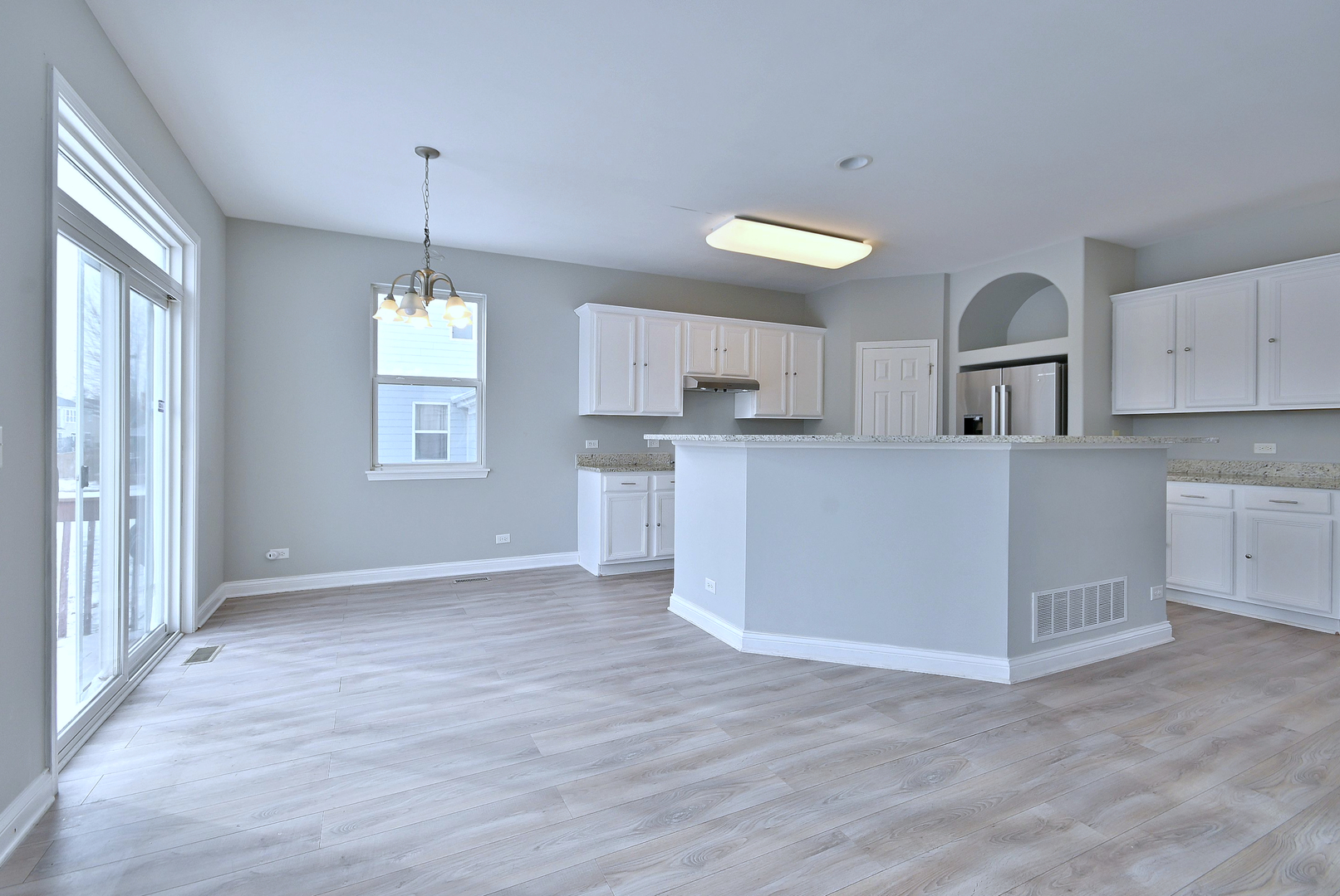 233 Pawtucket Avenue Elgin, IL 60124 - Photo 16 of 49 a view of a kitchen with center island and wooden floor