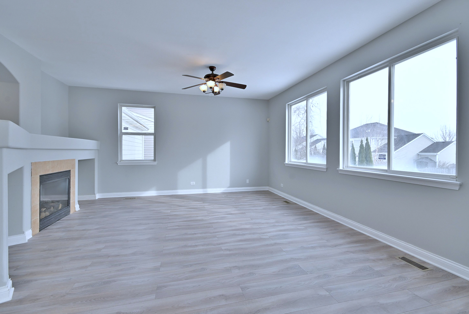 233 Pawtucket Avenue Elgin, IL 60124 - Photo 18 of 49 a view of an empty room with a window and wooden floor