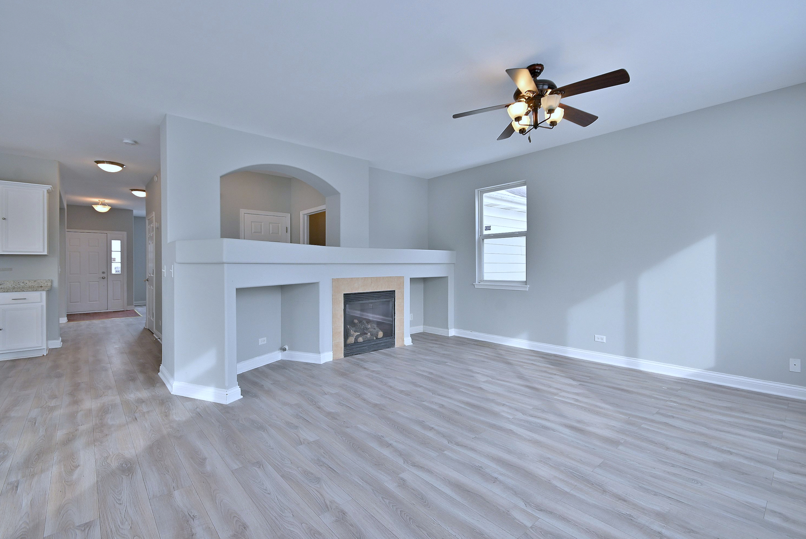 233 Pawtucket Avenue Elgin, IL 60124 - Photo 19 of 49 a view of an empty room with a window and wooden floor