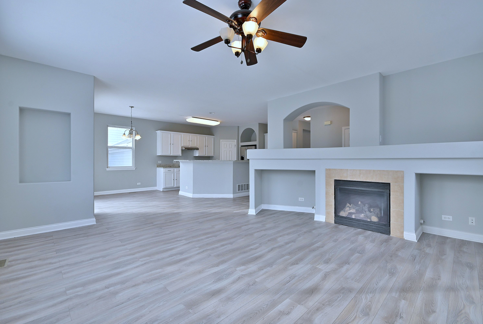 233 Pawtucket Avenue Elgin, IL 60124 - Photo 20 of 49 a view of empty room with wooden floor and fireplace