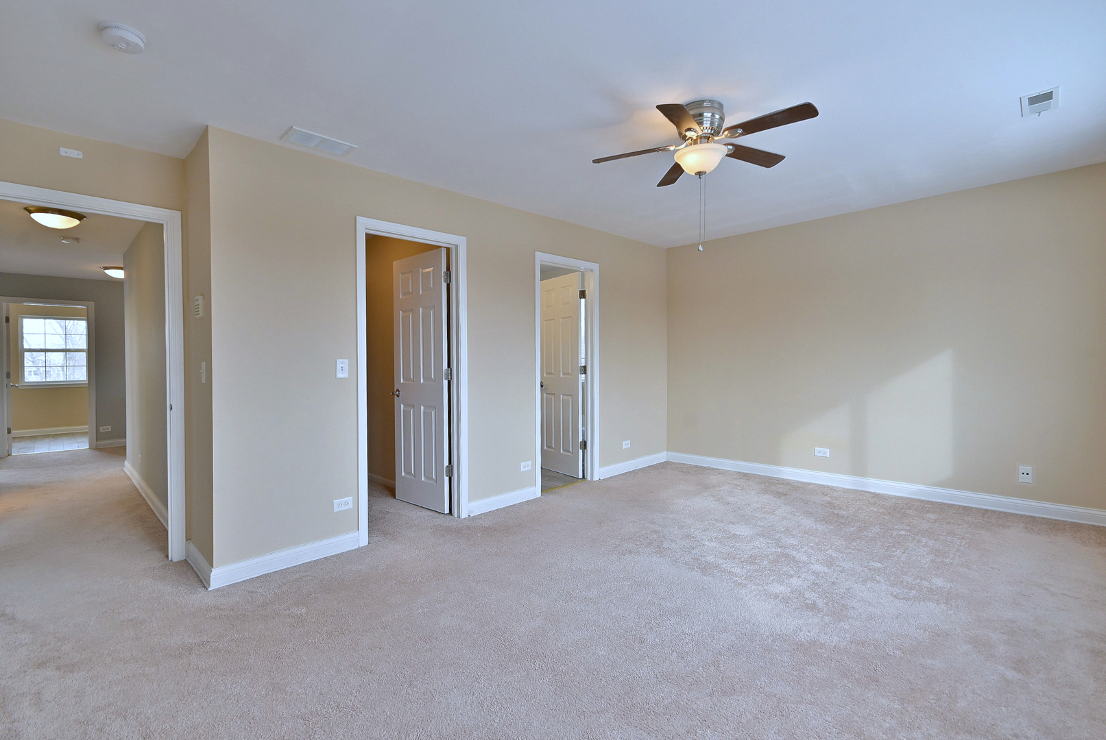 233 Pawtucket Avenue Elgin, IL 60124 - Photo 26 of 49 a view of an empty room with a ceiling fan
