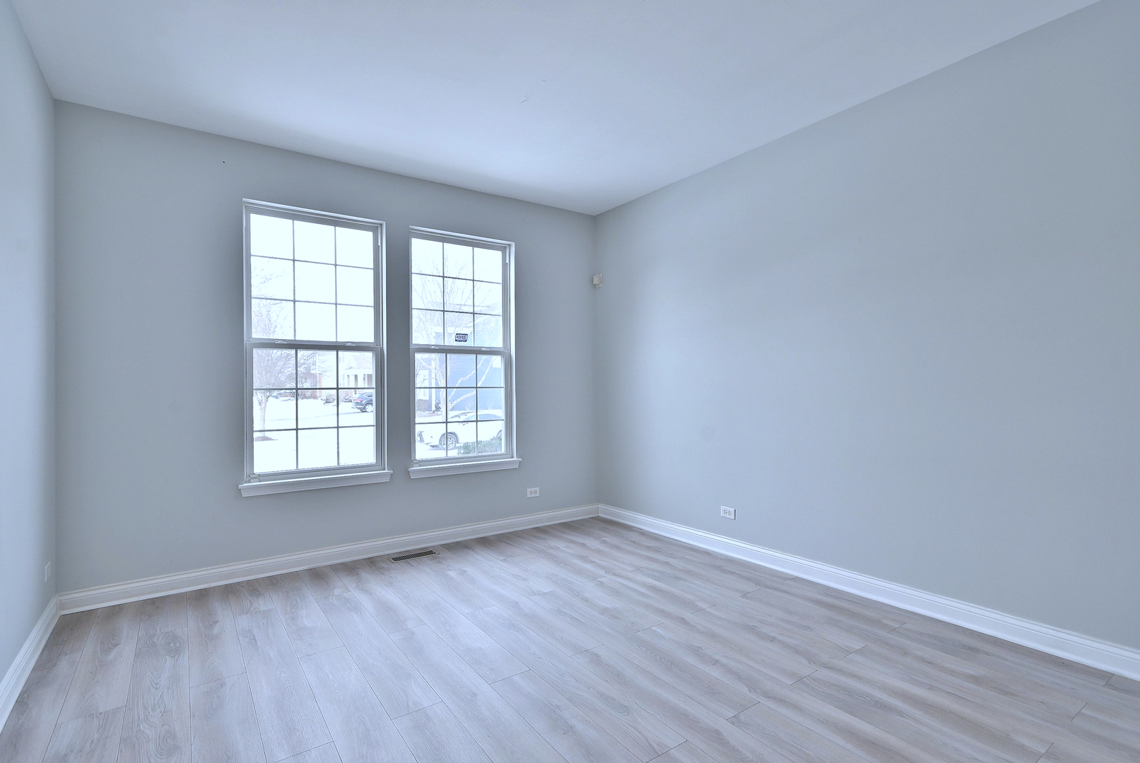 233 Pawtucket Avenue Elgin, IL 60124 - Photo 5 of 49 wooden floor in an empty room with a window