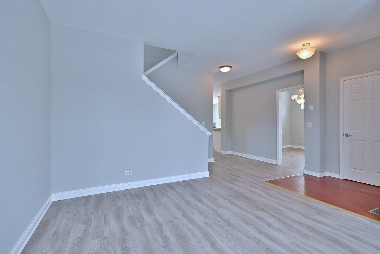 233 Pawtucket Avenue Elgin, IL 60124 - Photo 6 of 49 a view of a hallway with wooden floor