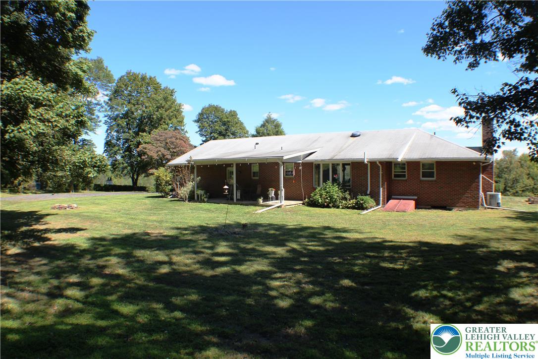 909 Wood Road Danielsville, PA 18038 - Photo 11 of 56 a front view of a house with a yard