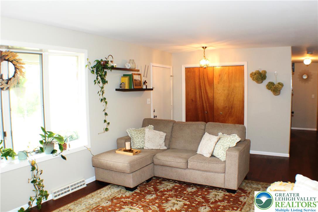 909 Wood Road Danielsville, PA 18038 - Photo 17 of 56 a living room with furniture and a window