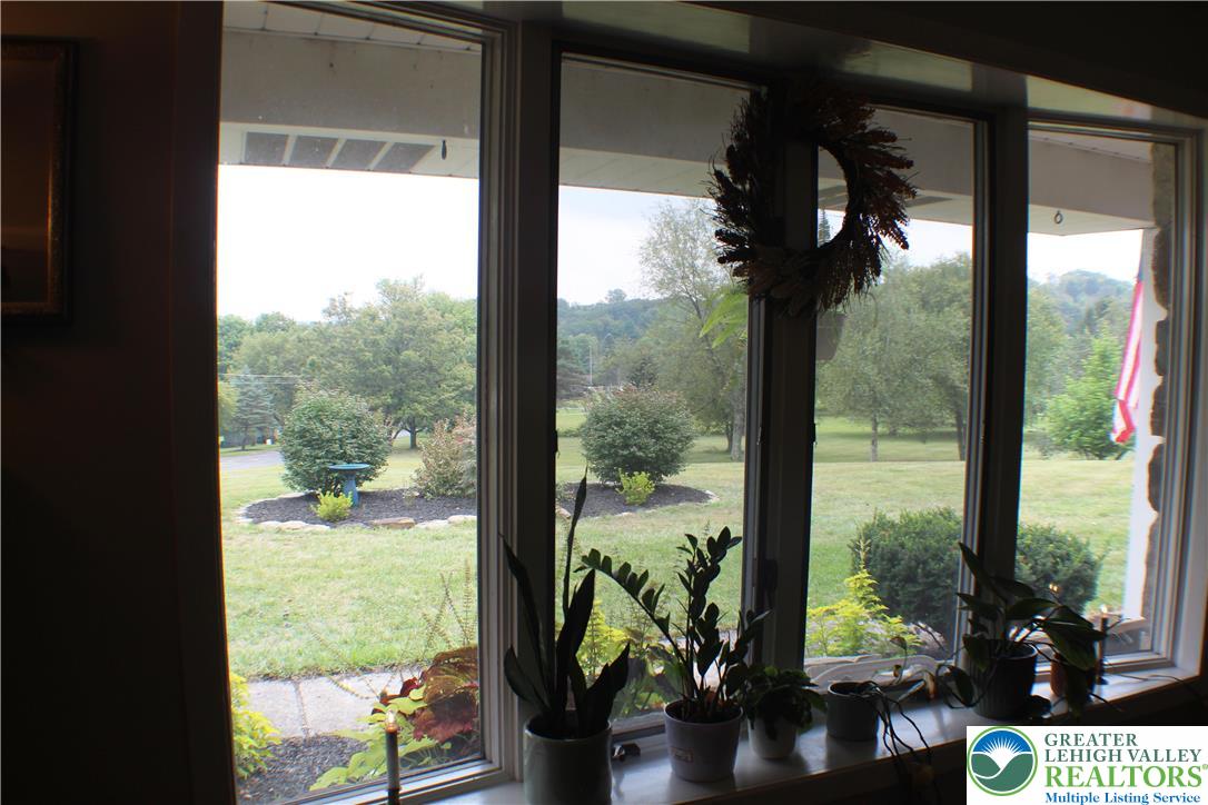 909 Wood Road Danielsville, PA 18038 - Photo 18 of 56 a view of a porch with furniture and garden