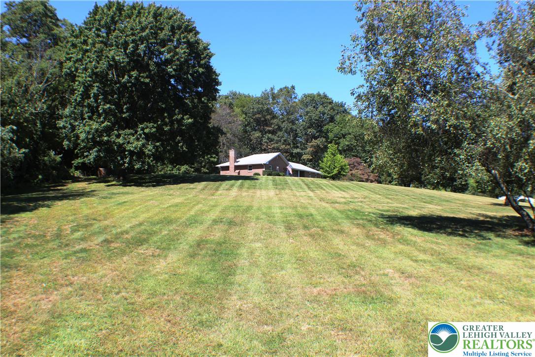 909 Wood Road Danielsville, PA 18038 - Photo 2 of 56 a view of a swimming pool with an outdoor space