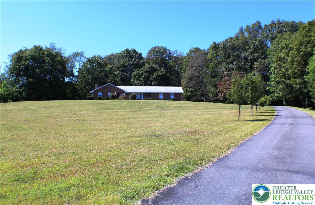 909 Wood Road Danielsville, PA 18038 - Photo 3 of 56 a view of a swimming pool with a yard
