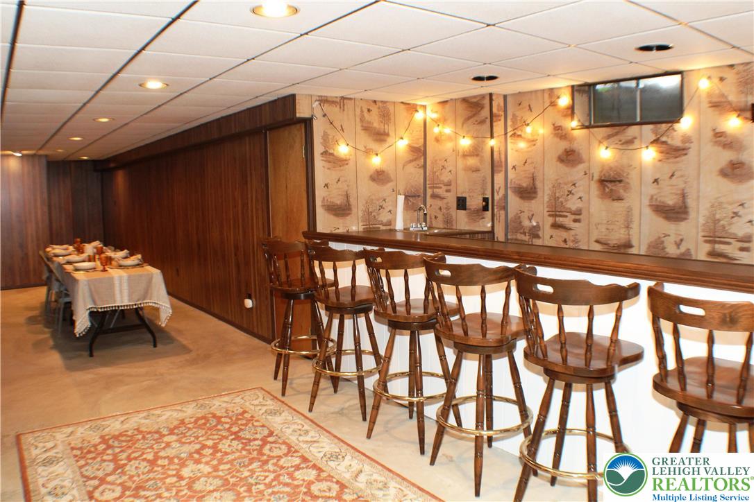 909 Wood Road Danielsville, PA 18038 - Photo 32 of 56 a hallway with table and chairs