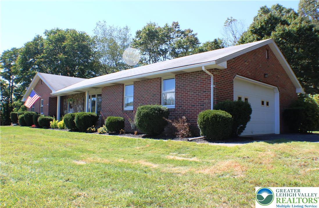 909 Wood Road Danielsville, PA 18038 - Photo 4 of 56 a view of a house with a yard and plants