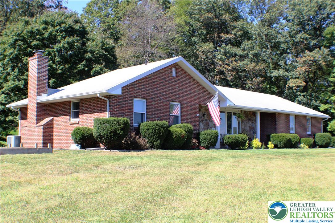 909 Wood Road Danielsville, PA 18038 - Photo 6 of 56 a front view of a house with a yard