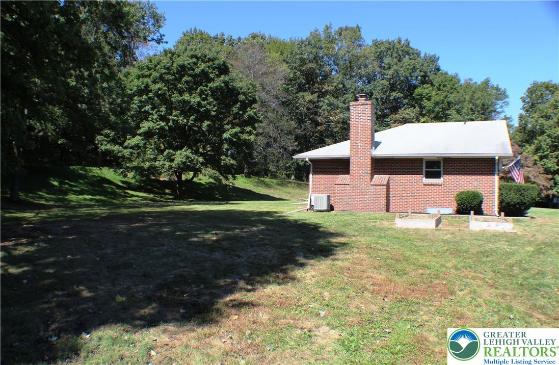 909 Wood Road Danielsville, PA 18038 - Photo 10 of 56 a front view of a house with garden