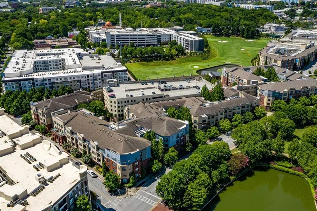 a open kitchen with granite countertop a stove and a wooden floors