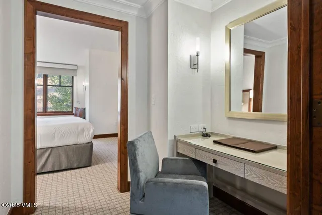 a bedroom with a bed and a table