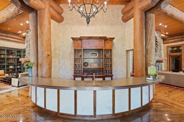 a view of balcony with two chairs and wooden floor