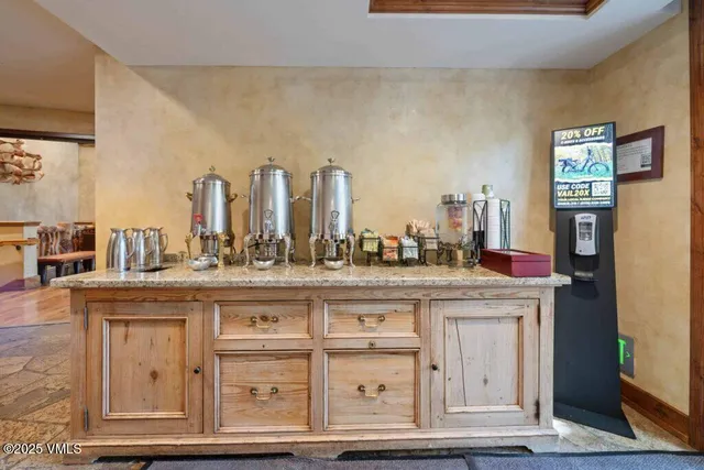a view of a kitchen with cabinets and a wooden floor