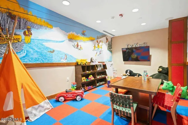 a room with furniture and a flat screen tv