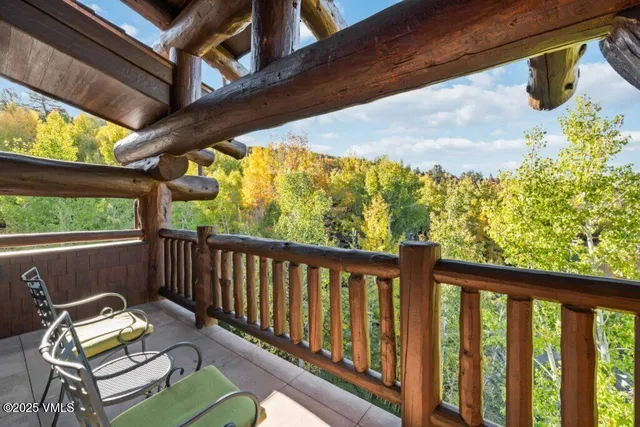 a view of balcony with wooden floor and outdoor seating