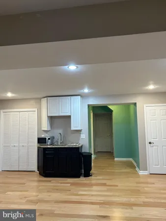 a kitchen with a refrigerator and a sink