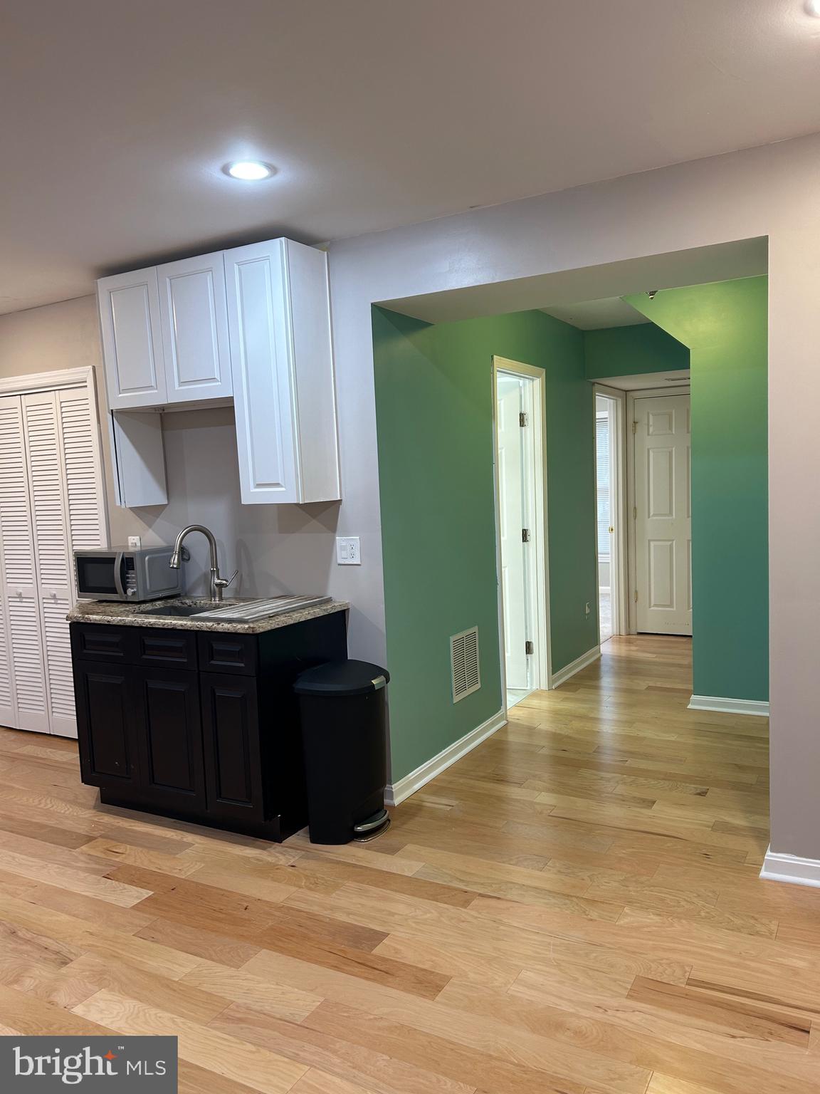 43455 Katling Square Chantilly, VA 20152 - Photo 2 of 12 a kitchen with granite countertop wooden cabinets and granite counter tops