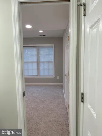 a view of an empty room and a window