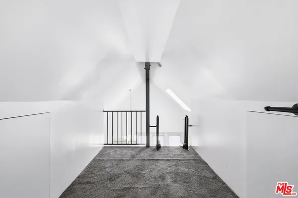 a view of a hallway with staircase