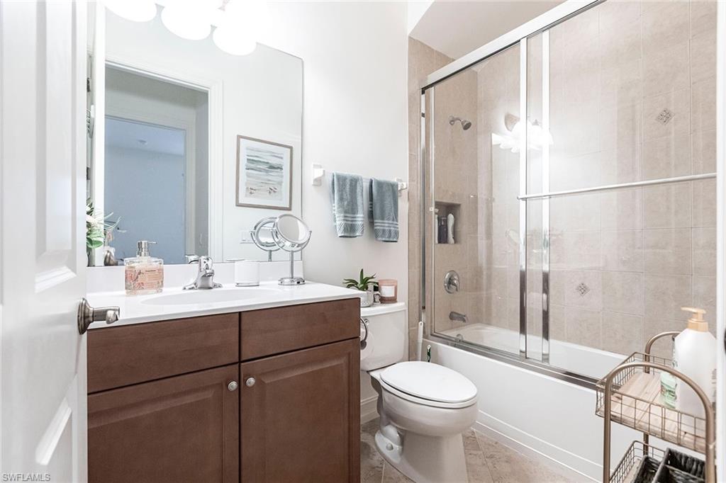 7863 Valencia Court Naples, FL 34113 - Photo 31 of 50 a bathroom with a sink toilet and shower