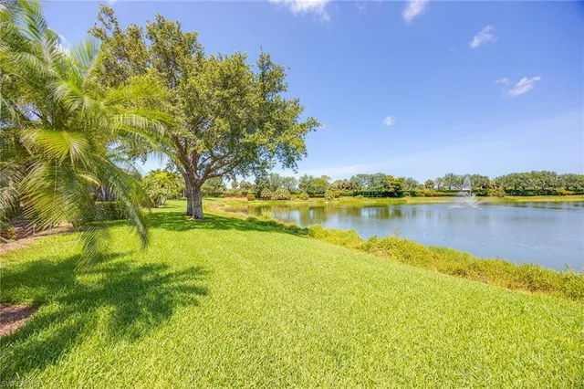 a view of a lake with houses in the background